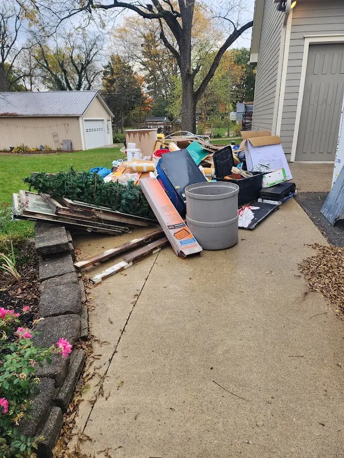 Dumpster being loaded with debris for Demolition Dumpster Rental in Kimberly